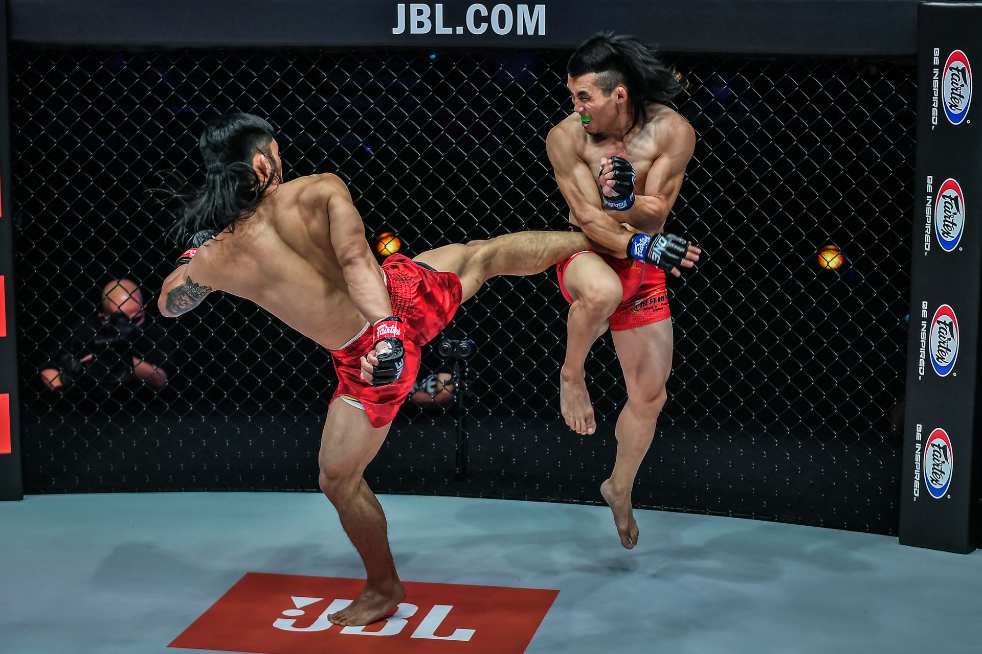 ONE-Revolution-Adiwang-body-kick-to-Hexigetu ONE: Revolution: Lito Adiwang shows no rust, stops Hexigetu's streak Mixed Martial Arts News ONE Championship - philippine sports news
