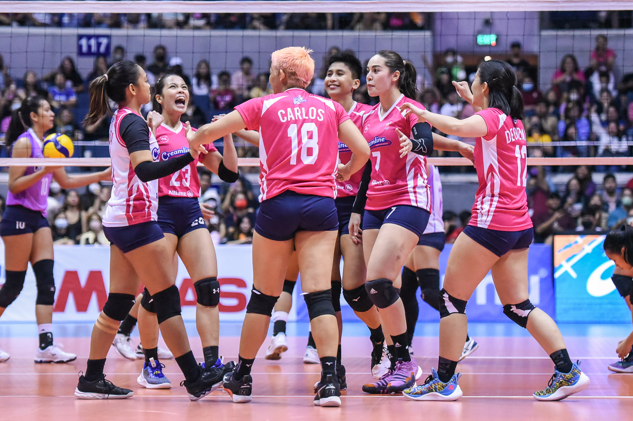 Creamline celebrates in game versus Choco Mucho