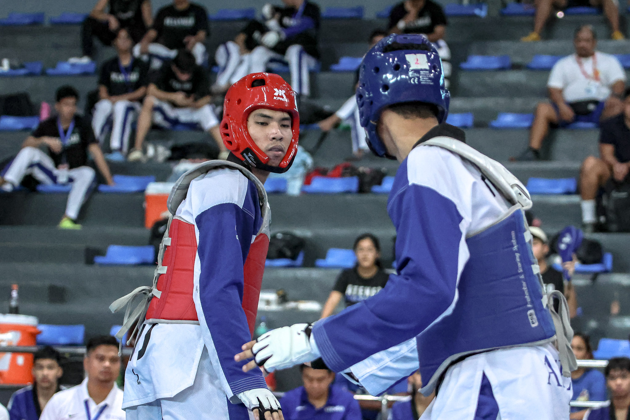 UAAP-86-Kyorugi-Carl-Ayaton-NU Barbosa-less NU conquers UST, secures UAAP Men's TKD five-peat ADMU DLSU FEU News NU Taekwondo UAAP UP UST - philippine sports news