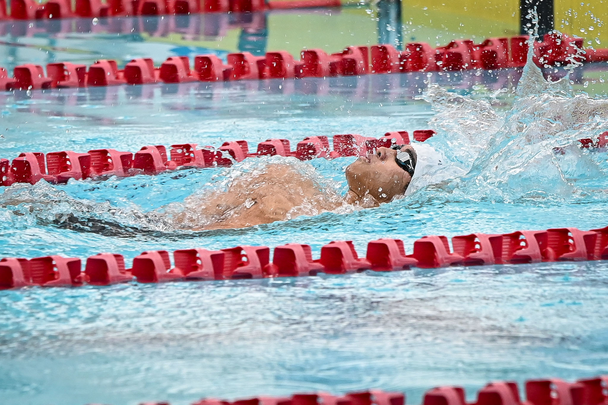 UAAP86-SWIMMING-MEN-200-LC-BACKSTROKE-ATENEO-PHILLIP-SANTOS-8498 UAAP 86 Swimming: Rian Tirol sets pace for Ateneo, breaks league record in 50m ADMU DLSU News Swimming UAAP UP UST - philippine sports news