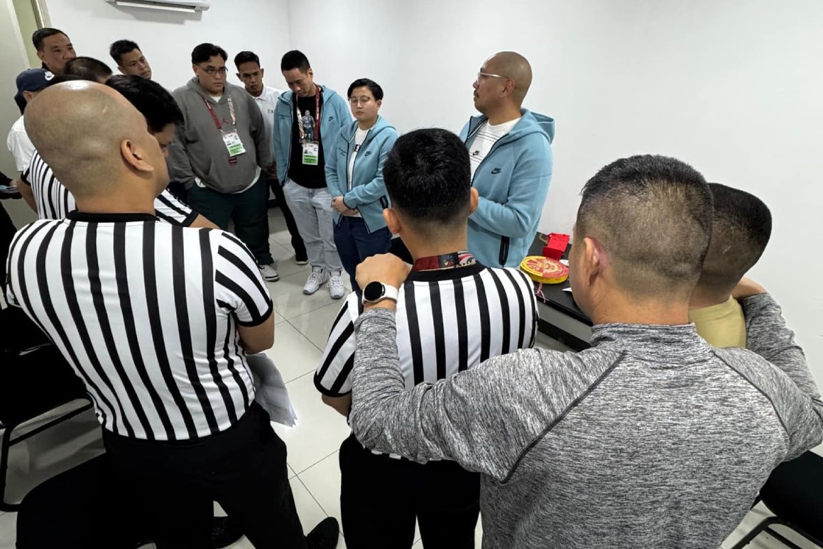 UAAP-87-Xavy-Nunag-with-basketball-referees 185 Games, 104 Days: UAAP basketball comm's office takes major steps to equality, excellence Basketball News UAAP - philippine sports news