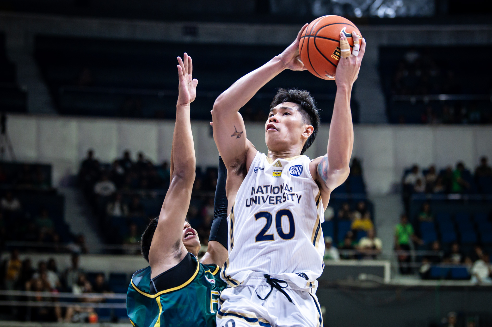 UAAP88-MBB-Jake-Figueroa-2460 NU pulls away late to sink FEU, stays unbeaten in UAAP Men's Basketball Basketball FEU News NU UAAP - philippine sports news