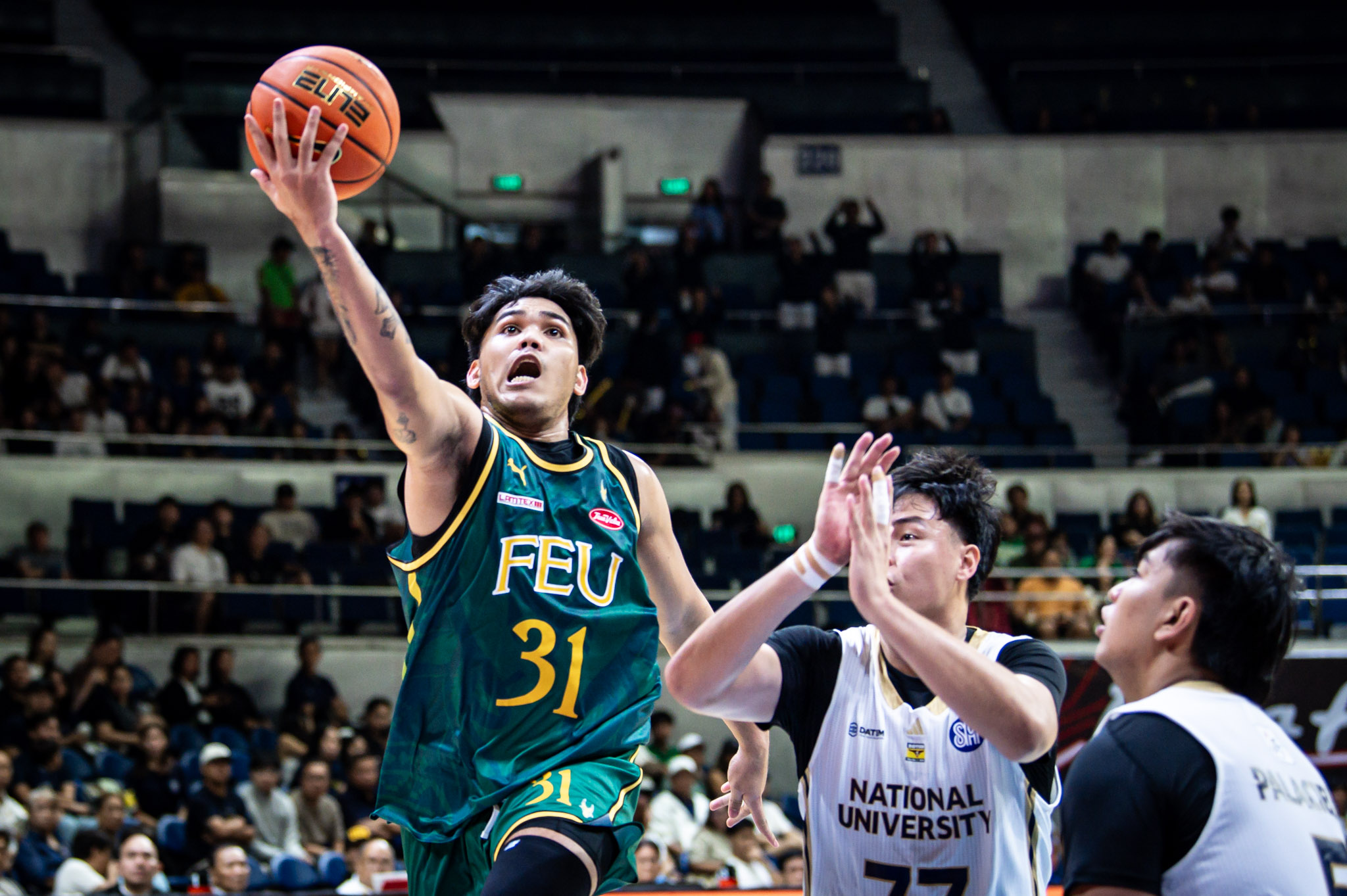 UAAP88-MBB-Kirby-Mongcopa-1950 NU pulls away late to sink FEU, stays unbeaten in UAAP Men's Basketball Basketball FEU News NU UAAP - philippine sports news