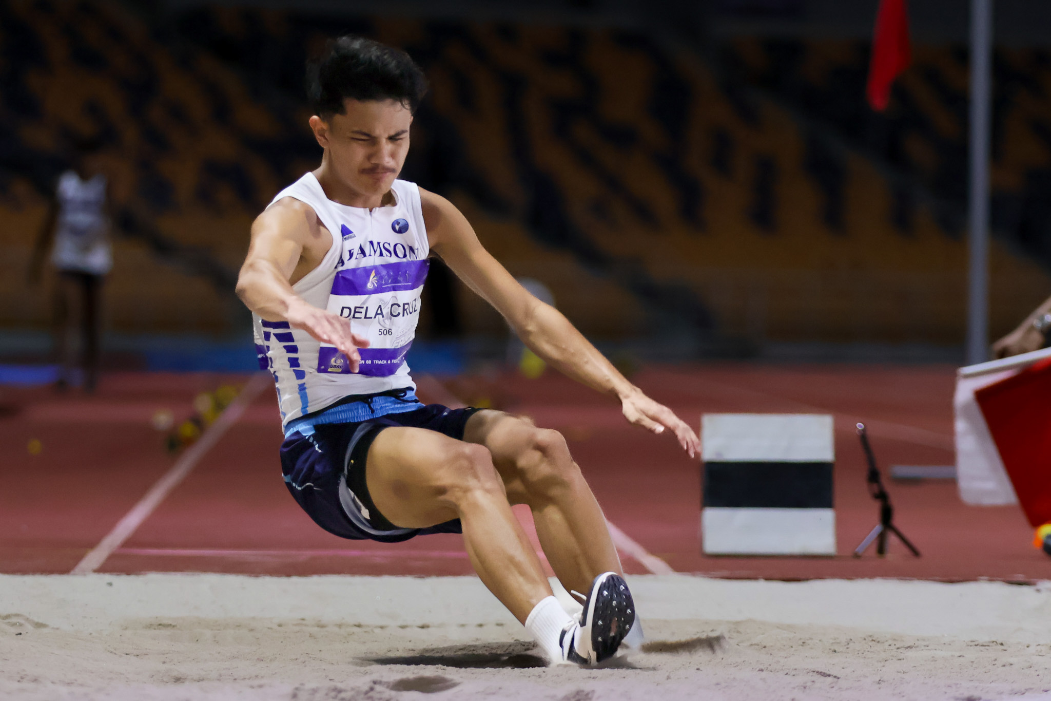 UAAP-88-Athletics-Long-Jump-Boys-Dela-Cruz-Janzen-0744 Magtubo’s record 5,000m win puts FEU ahead in UAAP Women’s Athletics ADMU AdU DLSU FEU News NU Track & Field UAAP UE UP UST - philippine sports news