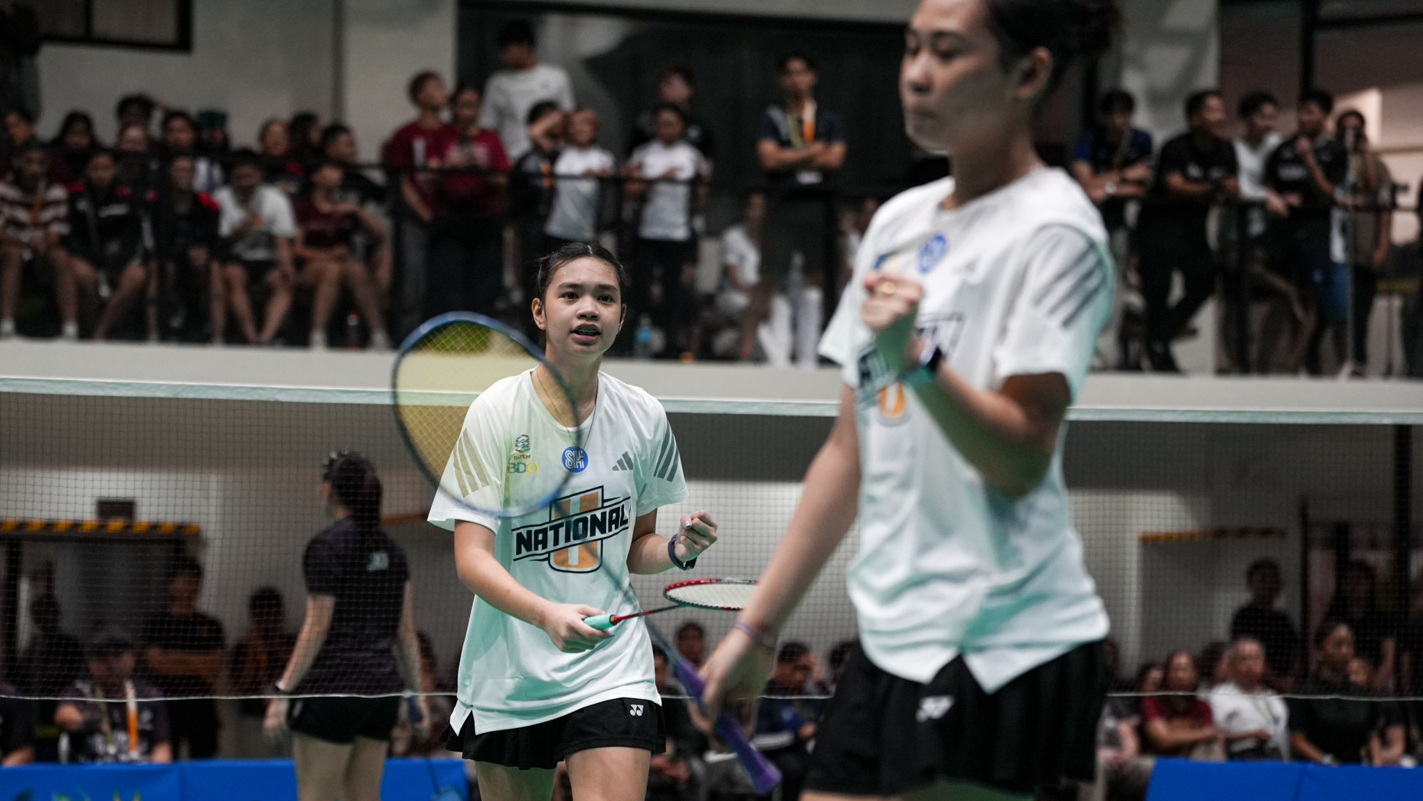 UAAP-89-Badminton-NU-vs-UP-Naeomi-Gulpany Hernandez sisters, cousins Diaz, Gulpany power Ateneo, NU to UAAP women's badminton semis ADMU AdU Badminton DLSU News NU UAAP UP UST - philippine sports news