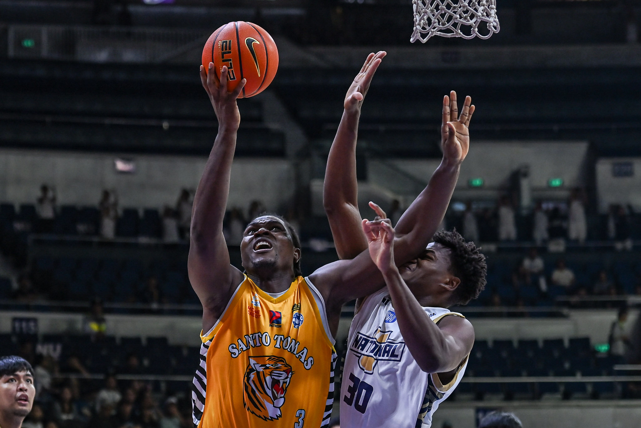 NU Bulldogs center Mo Diassana outduels UST counterpart Collins Akowe in UAAP Season 89 Men's Basketball