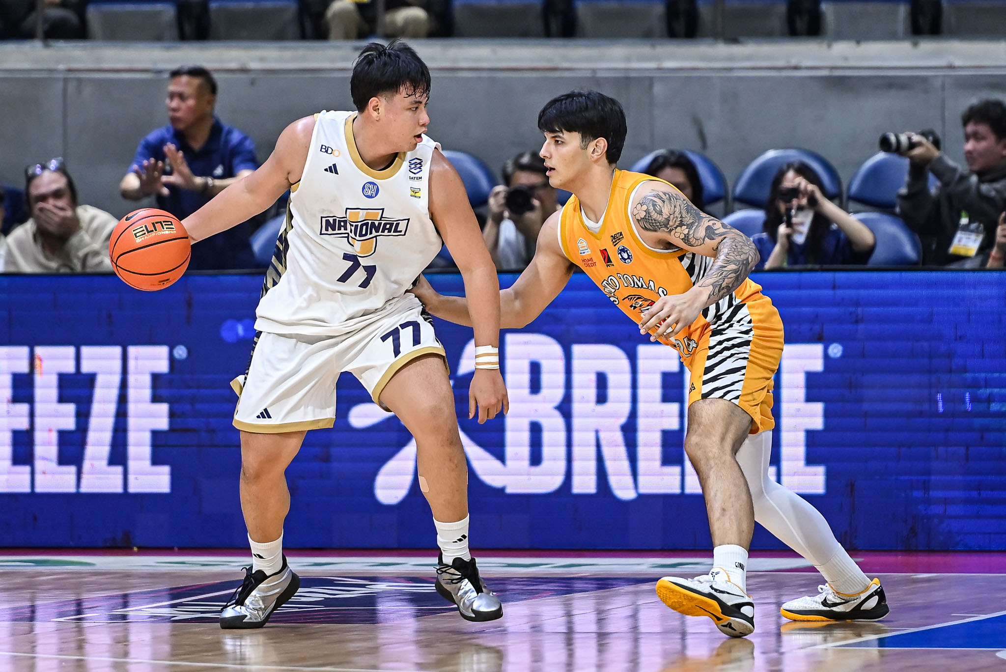 UAAP-89-MBB-NU-vs.-UST-Kenshin-Padrones-1327 Diassana dominates Akowe as NU holds off UST to stay solo second in UAAP men's basketball Basketball News NU UAAP UST - philippine sports news